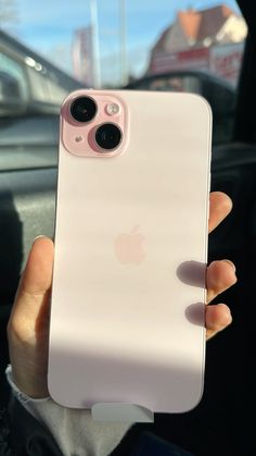 a person holding up an iphone case in their hand, with the camera on it's side