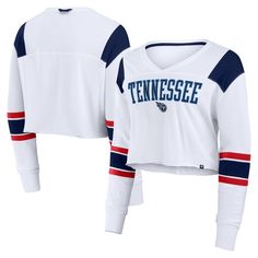 Add some modern style to your Tennessee Titans game day look with this Stretch Cropped Fashion Long Sleeve T-Shirt from Fanatics. This stylish top features an embroidered applique team logo and a tackle twill team wordmark on the chest for a spirited look that shows off your Titans pride. The oversized fit and cropped design elevates your style, making it perfect for game day or a casual outing. Game Day Long Sleeve Tops With Team Logo, Varsity Jersey Tops For Fan Gear, Varsity Graphic Print Top For Fan Gear, Game Day Sports Fan Crew Neck Top, Collegiate Graphic Print Top For Game Day, Sports Fan Long Sleeve Top With Team Logo, Sports Fan Crew Neck Top For Game Day, Team Colors Tops For Game Day, Long Sleeve Tops With Team Logo For Sports Events