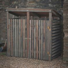 an outhouse with wooden slats on the outside