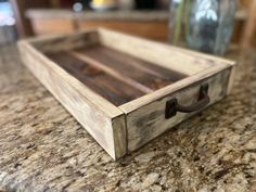 a wooden tray sitting on top of a counter