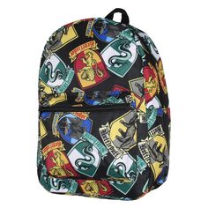 a harry potter backpack with hogwarts and crests all over the front, on a white background