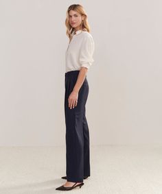 Wool Jones Trouser Navy Our take on classic Italian suiting comes to life in the form of a trouser designed to replace every pant in your wardrobe. With elevated tailoring and all-day comfort, this trouser is an all-purpose pant in disguise. Style with a t-shirt and sneakers or a kitten heel and silk shirt—the outfit options are endless. 95% wool, 5% elastane. Made in China of Italian fabric. Double pleat Italian trouser with relaxed-straight leg. | Jenni Kayne Women's Wool Jones Trouser Size 10 Outfit Options, Italian Suit, Trouser Design, Jenni Kayne, In Disguise, Classic Italian, Italian Fabric, Slipper Boots, New Tops