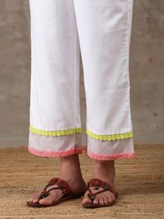 A three piece soft cotton kurta set in white comes with an attached mulmul lining. It has colour block laces with organza insert on the neck,sleeves and pants. It is paired with a white soft cotton straight pant with an attached mulmul lining with organza insert and colour block laces. Color: White Fabric Composition: Kurta Set - Soft cotton Dupatta - Organza Note: The product will be delivered within 20-25 days of order placed Care Instruction: Dry Clean Only. Do not use heavy Iron Designer Cotton Palazzo Set With Gota Work, White Palazzo Set With Gota Work For Eid, Designer Cotton Dupatta For Spring, Eid White Palazzo Set With Gota Work, Spring White Cotton Silk Dupatta, Cotton Palazzo Set With Gota Work, White Chanderi Palazzo Set With Gota Work, Cotton Palazzo Set With Gota Work For Eid, White Sets With Gota Work For Spring