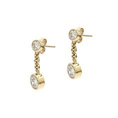 Turn heads with these alluring lab grown diamond studded dangle earrings. Crafted in 14K gold, each round bezel set lab diamond stud dangles a larger stud in a chain link drop. The brilliant round cut lab grown diamonds have a I-J color and VS-SI clarity for a radiant brilliance and 1 1/2 carat total weight that complements any outfit. The Sku number is 456113 IL Certificate is available upon request. Yellow Gold Bezel-set Dangle Diamond Earrings, Formal Bezel Set Dangle Diamond Earrings, Formal Dangle Diamond Earrings With Bezel Setting, Classic Diamond Dangle Earrings With Bezel Setting, Classic Dangle Diamond Earrings With Bezel Setting, Classic Bezel-set Diamond Dangle Earrings, Gold Dangle Diamond Earrings With Bezel Setting, Fine Jewelry Diamond Drop Earrings With Bezel Setting, Anniversary Bezel Set Dangle Diamond Earrings