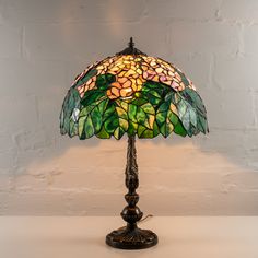 Category: Stained Glass Lamps Stained glass Tiffany lamp with green leaves and white flowers is a perfect item of home decor, as these calming colors will definitely make the atmosphere at your place of living more relaxing. At the same time this lamp will make your room more stylish! Measurements: 24,8 x 16,3 inch (630 x 415 mm) ⠀ In the process of stained glass lamps manufacturing, we refer to the method of copper foil suggested by L.C. Tiffany. We use only the high-quality materials, such as:• 3 mm Spectrum Glass • 3 mm Wissmach Glass • 3 mm Uroboros Glass • Tin• Copper Foil• Black Patina• Wax ⠀ All stained glass lamps should be wiped with a wet piece of cloth only. ⠀ Each stained lamp is safely packed into a brand box for delivering it to our customers safe and sound. _________________ Pic Candle, Spectrum Glass, Mountain Pictures, Tiffany Lamp, Glass Lamps, Stained Glass Lamps, Mosaic Table, Tiffany Lamps, Art Story