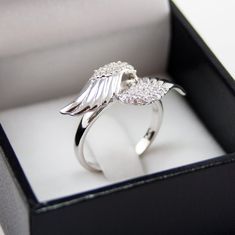 A lovely sterling silver Angel wings ring with beautiful simulated diamonds. Finished in rhodium for a longer lasting shine, this ring is the perfect touch of class and sophistication. Please select ring size in down bar, thank you! * Officially Licensed Product - passed through examination and requirements by the Sorority. In addition, part of the sales proceeds goes back to Pi Beta Phi. * Product includes lifetime warranty: We pride ourselves in our high quality products and stand by our craft Angel Accessories, Aesthetic Ring, Diamond Angel, Angel Wing Ring, Angel Ring, Aesthetic Rings, Fashion Angels, Party Aesthetic, Necklace Moon