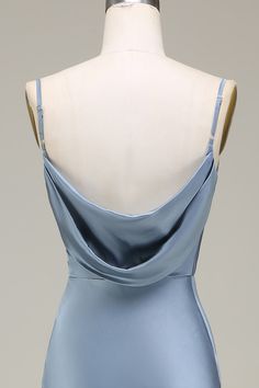 the back of a blue dress on a mannequin headdress with an open shoulder