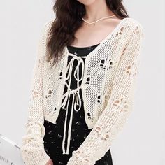 Details:    Get it by Cost less than   $12       only with 10% OFF New Year Deals Promo code:   sunifty.   15% OFF any 2, Free Shipping $70. Free Exchange & Easy Returns.    This  Hollow Out Tie Front Cardigan  is elastic fitting, long sleeves and tie front   Grunge Fairy Aesthetic Fairycore tie front crochet tops  can be wore over camis, bralettes and dresses   Material: Cotton& Spandex Color: White/Blue Size Details: One Size For All:   Shoulder 40 cm, Sleeve 24 cm, Length 40 cm; Design: Cozy, Crochet Knitted, Elastic Fitting, Open Front, Front Tie,Tie Front, Long Sleeve, Casual and College Style. Weight: approx 0.19 kg Machine Wash Cold, Machine Dry. Grunge Fairy Aesthetic, Cardigan Cottagecore, Fairycore Clothing, Cottagecore Blouse, Clothing Grunge, Aesthetic Fairycore, Crocheted Cardigan, Clothes Grunge, Blouse Crochet