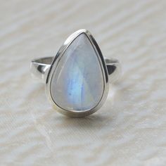 Pear Rainbow Moonstone Gemstone 925 Sterling Silver Ring, 18K Rose Gold, 18K Yellow Gold Moonstone Ring Jewelry, Unique gift Jewelry Gemstone : Rainbow moonstone Stone Size : 10 x 14 mm Ring Size : Please Choose Your Size stone Color : Rainbow Moonstone Material : Please choose your metal It's a unique gift for anyone zodiac style ring . Please Notice before checkout :- Due to we use natural stones, the stones may vary slightly in shape, size and color. Contact us for any other gemstone customiz Fine Jewelry Moonstone Ring With Natural Stones For Gift, Sterling Silver Teardrop Moonstone Ring Gift, Fine Jewelry Moonstone Teardrop Ring, Fine Jewelry Teardrop Moonstone Ring, Hallmarked Moonstone Ring For Anniversary, Sterling Silver Teardrop Moonstone Ring, Sterling Silver Cabochon Moonstone Ring For Anniversary, Teardrop Moonstone Gemstone Ring, Elegant Moonstone Ring With Natural Stones For Anniversary