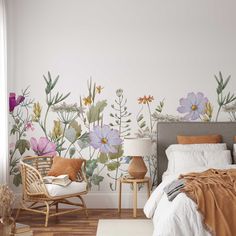 a bedroom with flowers painted on the wall