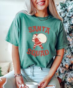 Get into the festive spirit with this Christmas T-shirt featuring a fun 'Santa Squad' design. Made with high-quality, garment-dyed fabric for a soft color and texture, this Comfort Colors 1717 tee is perfect for spreading holiday cheer. Available in sizes S to 4XL, this unisex T-shirt is ideal for men and women looking to add a touch of Christmas joy to their wardrobe. Product features - Available in sizes S to 4XL for a perfect fit - Double-needle stitching for durability - Made with garment-dy Top Christmas Gifts, Christmas Tops, Xmas Shirts, Christmas Joy, Dyed Fabric, Christmas Santa, Christmas Shirt, Christmas Tshirts, Soft Colors