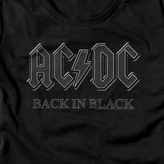 Junior's ACDC Back In Black T-Shirt Love classic rock? Show it off in this stylish ACDC Back In Black T-Shirt! Its lightweight, breathable cotton makes for comfortable all-day wear, so you can turn up the music and rock out with style. What are you waiting for? Get your ACDC T-Shirt now! Officially Licensed 60% Cotton, 40% Polyester Short Sleeves Color: Black Printed in the U.S.A. with eco-friendly inks Machine Washable Listed in juniors sizes ** This product ships direct from the manufacturer w Black Cotton Rock And Roll T-shirt, Black Band Logo T-shirt For Concert, Black Band Logo Crew Neck Top, Black Crew Neck Tops With Band Logo, Black Crew Neck Top With Band Logo, Rock Style Cotton T-shirt With Logo Print, Black Text Print Top For Concert, Rock And Roll Black Cotton T-shirt, Black Band Logo Tops For Concert