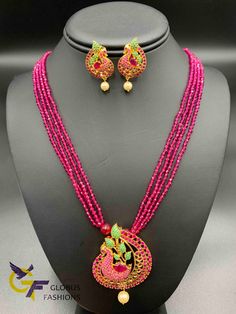 Cute multicolor stones Peacock design pendant with matching pink beads chain Handmade jewelry One gram gold jewelry Silver-plated jewelry Official Website globusfashions.com 🌸 S H O P . M O R E . S T Y L E S 🌸 https://www.etsy.com/shop/Globusfashions Necklaces - https://www.etsy.com/shop/Globusfashions?section_id=18712263 Bracelets - https://www.etsy.com/shop/Globusfashions?section_id=18969767 Pendant Sets - https://www.etsy.com/shop/Globusfashions?section_id=18707402 Tikka - https://www.etsy. Pink Gold Plated Round Necklace, Red Peacock Design Necklace As A Gift, Red Peacock Design Necklace As Gift, Red Peacock Design Necklace For Gift, Festive Multicolor Gemstone Beads Jewelry, Multicolor Gold Beads Jewelry For Celebration, Traditional Pink Necklaces With Colorful Beads, Traditional Pink Beaded Necklace, Traditional Pink Gemstone Beads Necklaces