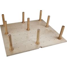 a wooden peg board with four posts on it and two holes in the middle to connect them