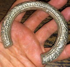 Superb late 19th century Chinese wedding bracelet, silver metal over unknown core, circa 1890s, w dragons, chrysanthemums, and the good luck Chinese symbol, shou coin. Nice weight and authentic period piece. The bracelet has an opening making it fit medium to large wrists. Fine detail, nice warm patina, unpolished, lovely. Sold as found. View all photos and zoom in for details. It's assumed you've read the description and viewed all photos before purchase. Traditional Carved Wedding Jewelry, Traditional Carved Bracelets For Wedding, Traditional Carved Bangle For Wedding, Traditional Carved Wedding Bracelets, Antique Metal Bangle For Ceremonial Occasions, Antique Finish Bracelet Jewelry For Ceremonial Occasions, Ceremonial Carved Bracelet Jewelry, Ceremonial Antique Finish Bracelet, Antique Carved Jewelry For Rituals