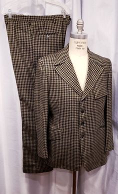 Beautiful houndstooth cloth two piece suit probably made in the 70's but exceptional quality. With the proper accessories it would be hard to tell this is not a true period piece, but the next best thing. Ready for the Dickens Faire or a period holiday party. Inside label reads: Mike Bain Inside pocket still has the Amalgamated Union Tag made in the USA the United States of America. Coat measures: Shoulders 18 1/2 inches, Chest 45 inches, sleeves 25 inches and length is 31 inches. Pants measure: Fitted Houndstooth Suits For Fall, Retro Fitted Formal Sets, Vintage Formal Sets For Fall, Retro Fitted Sets For Formal Occasions, Vintage Fitted Houndstooth Blazer, Fitted Vintage Houndstooth Blazer, Vintage Formal Tweed Jacket With Houndstooth Pattern, Vintage Tweed Jacket With Houndstooth Pattern For Formal Occasions, Vintage Houndstooth Tweed Jacket For Formal Occasions