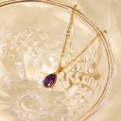 Celebrate personal significance with the Birthstone Necklace, featuring a chosen gemstone on an 18k gold-plated chain. This necklace offers a meaningful and elegant way to wear your birth month or a loved one's. Gold Elegant Charm Necklaces For Healing, Gold Amethyst Jewelry With Delicate Chain, Purple Gold-plated Necklace As A Gift, Purple Gold Plated Necklace For Gift, Purple Gold-plated Necklace For Gift, Elegant 14k Gold-filled Crystal Necklace Gift, Gift Purple Gold Plated Necklace, Gold Birthstone Crystal Necklace With Teardrop Pendant, Healing Gold Birthstone Necklace With Gemstone