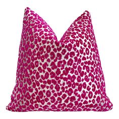 a pink and white leopard print pillow on a white background