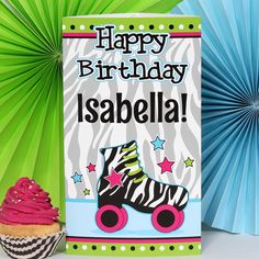 a birthday card with a zebra print roller skates and cupcake next to it