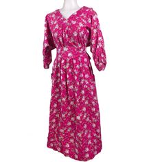 Vintage Laura Ashley Hot Pink Floral Maxi Dress. Features Dolman Sleeves, Two Hand Pockets, Gathered Waistline And Includes Matching Sash. The Sash Has Some Fraying On The Tip Of The Triangle And Edges And There Are A Few Holes At The Bottom Hem Of The Dress - See Photos For Details. Us Size Medium 100% Cotton Extra Button On Label Made In Carno Wales Uk Machine Wash Warm Or Hand Wash. Measures 20" Sleeve 46" Length Pink Floral Maxi Dress, Laura Ashley Dress, Hot Pink Floral, Pink Floral Dress, Laura Ashley, Dolman Sleeve, Floral Maxi Dress, Floral Dress, Pink White