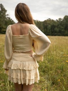 This off shoulder crop top and skirt set features a ruched smocked body and drawstring bust. The model is wearing a size medium. Spring Ruched Square Neck Crop Top, Spring Ruched Crop Top With Square Neck, Off-shoulder Crop Top With Smocked Bodice, Spring Off-shoulder Crop Top With Smocked Bodice, Crop Top And Skirt Set, Crop Top And Skirt, Top And Skirt Set, Off Shoulder Crop Top, Top And Skirt