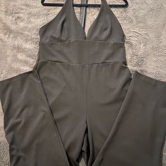 Ideal For Cocktail Parties, Formal Parties Or Just To Look Spectacular On Date Night !! Black Jumpsuits And Rompers With Lined Body For Party, Black Lined Jumpsuits And Rompers For Party, Black Party Jumpsuits And Rompers With Lined Body, Black Jumpsuit With Lined Body For Party, Sleeveless Lined Jumpsuits And Rompers For Party, Elegant Black Jumpsuits And Rompers With Lined Body, Black Party Jumpsuit With Lined Body, Black Halter Neck Jumpsuit For Party, Stretch Halter Neck Jumpsuits And Rompers For Night Out