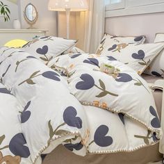 the comforter is made up with blue and white flowers