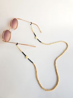 face mask chain, Glasses Chain, Laces for Sunglasses, Sunglass Holder, chain sunglasses, eyeglass chain, eyeglass strap, boho chain, strap Handmade eyeglass holder.  The strap is 29,5 inches long, if you pretend another size please let me know :) Handmade with love :) Modern Adjustable Gold Glasses Chains, Adjustable Gold Minimalist Glasses Chains, Gold Minimalist Adjustable Glasses Chains, Minimalist Gold Glasses Chains For Everyday, Black Glasses Chains For Summer Beach, Bohemian Glass Glasses Chains As Fashion Accessory, Trendy Adjustable Gold Glasses Chain, Bohemian Glass Glasses Chains, Trendy Gold Glasses Chains For The Beach