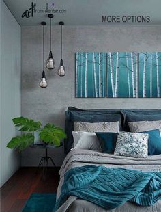 a bedroom with blue and grey bedding, green rugs and paintings on the wall