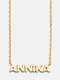 Spell it out with the 18K Gold Mini Nameplate Necklace. This custom name piece features a modern gold chain attached to your choice of a pavé or gold nameplate. Featuring the personalization of your choosing. Crafted with 18K gold plated sterling silver and Cubic Zirconia stones, you'll be wearing it for years to come. Customizable Luxury Yellow Gold Necklaces, Luxury Gold Name Necklace With Custom Name, Luxury Personalized Initial Pendant Name Necklace, Customizable Yellow Gold Initial Pendant Necklace, Custom Yellow Gold Initial Pendant Necklace, Luxury Customizable Nameplate Necklaces, Luxury Customizable Nameplate Necklace, Modern Personalized 14k Gold Necklaces, Custom 14k Gold Nameplate Necklace