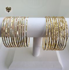 Bangles Bracelet. 2mm in girth. Available in size 2.1/4'', 2.5'', 2.3/4''. Sold by Dozen (12 pc) Choose the desired style. *Note* BGF=Brazilian Gold FilledBGO=Brazilian Gold Overlay Vietnamese Gold Bangles, Vietnamese Jewelry, Brazilian Gold, Bangle Bracelet Set, Bangles Jewelry Designs, Stainless Steel Bangles, Dope Jewelry, Gold Overlay, Bangle Designs