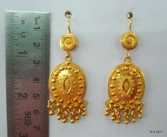 "ethnic sterling silver gold vermeil gold gilded earring pair from rajasthan india. nice handmade design good for jewelry collection. long max.- 6.2 cm(2.4\") width max.- 2 cm(0.8\") weight - 16 grams material - Good Silver with gold plate." Ornate Gold Danglers With Meenakari, Ornate 22k Gold Earrings With Latkans, Gold Ceremonial Drop Plug Earrings, Gold Drop Plug Earrings For Ceremonial Occasions, Gold Brass Earrings In Temple Jewelry Style, Gold Temple Jewelry Earrings Made Of Brass, Gold Brass Temple Jewelry Earrings, Gold Plated Temple Jewelry Danglers For Ceremonial Occasions, Gold Temple Jewelry Style Drop Earrings