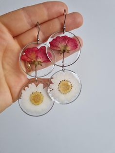 Beautiul pink rose buds earrings. Natural earrings , real dry rose and daisy cover with resin . These earrings are made from carefully selected real roses 🌹dry and cover in shiny and transparent resin. Keep in mind that in nature any color change is very natural over time. With every flower is a little bit different some take a year long to lose some color some of them take longer, and sometime i use some colorful paint to give even more attractive options that stay for a long time. Unique piec Sterling Silver Flower Earrings With Pressed Flowers, Silver Pressed Flower Resin Earrings, Silver Pressed Flower Earrings In Resin, Handmade Dainty Flower Earrings, Silver Resin Earrings With Pressed Flowers, Dainty Flower-shaped Earrings With Pressed Flowers, Dainty Flower Earrings With Pressed Flowers, Pink Resin Flower Earrings With Pressed Flowers, Handmade Silver Resin Flower Earrings