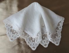 Gorgeous vintage fancy hanky. Perfect bridal hanky for a modern bride wedding handkerchief. This fine hankie has exquisite, intricate and beautiful lace trim. It measures 11.25 inches by 11 inches, fine linen center, in wonderful condition. Would be very pretty to frame or make wonderful heirloom quality gifts for the bride or bridal party or any other special occasion. Small enough to be slipped into a greeting card for a lovely gift. Please do view our other beautiful vintage and antique hankies! If you purchase 3 or more Trims or Hankies or/and Postcards/Cards shipping will be FREE ! We ship internationally and combine shipping. Elegant Lace Wedding Handkerchief, Elegant Wedding Handkerchief With Lace Work, Elegant Lace Work Handkerchief For Wedding, Elegant Lace Work Wedding Handkerchief, Elegant White Handkerchiefs For Wedding Gift, Elegant White Handkerchiefs With Lace Work, Elegant White Handkerchiefs For Bridal Shower, Handmade White Wedding Handkerchiefs, Upcycled Wedding Dress