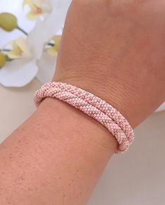 The bracelet is handmade of high quality materials. Japanese seed beads Miyuki Delica and high quality metal fittings!  The slider clasp is very convenient. It is easy to use The bracelet is layered, sparkling and looks good on the hand COLOR:  Rose peach, beige, brown, light peach, turquoise, rose gold (colors may vary slightly from the colors in the photo) If you are looking for another bead crochet bracelet  designs, please visit section "Wide crochet bracelets" https://www.etsy.com/shop/rdmi Handmade Rose Gold Beaded Bracelets For Everyday, Handmade Rose Gold Beaded Bracelets, Handmade Rose Gold Beaded Bracelet With Round Beads, Handmade Rose Gold Beaded Bracelet, Handmade Rose Gold Bracelets With Round Beads, Handmade Rose Gold Bracelet With Round Beads, Handmade Pink Braided Bracelets, Pink Handmade Braided Bracelets For Everyday, Everyday Handmade Pink Braided Bracelets