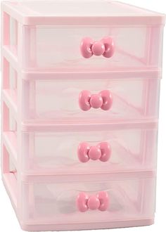 three drawers with pink handles and bows on them