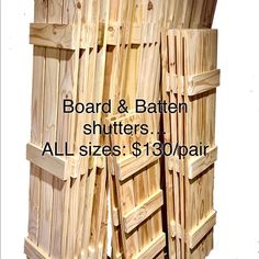 wooden shutters are stacked on top of each other in order to be used for storage