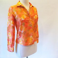 1960s Cotton Orange Hippie Blouse Long Sleeve Button Down | Etsy Orange Floral Print Collared Shirt, Orange Collared Shirt With Floral Print, Orange Cotton Blouse With Button Closure, Orange Cotton Blouse With Floral Print, Retro Long Sleeve Orange Blouse, Retro Orange Long Sleeve Blouse, Fitted Orange Button-up Blouse, Orange Floral Print Long Sleeve Blouse, Orange Long Sleeve Blouse With Floral Print