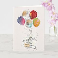 a birthday card with balloons on it and the words i year happy anniversary written below