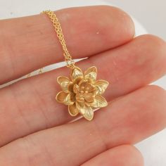 "This lotus flower pendant makes for such a sweet and feminine necklace. The details on the lotus are so delicate and timeless, and it's just such a cute size. I love the little capillaries visible in the petals and the little sprigs in the center of the flower. The details really are just perfect and so very dainty. I've kept everything as minimal as possible, and made the option of adding some stellar amethyst cushion cut dangles if you want some sparkle to go with the slightly matte flower. R Cheap Gold Charm Necklace With Flower Pendant, Luxury Gold Plated Flower Pendant Jewelry, Luxury Traditional Flower Pendant Jewelry, Cheap Elegant Flower Pendant Jewelry, Cheap Elegant Flower Pendant Necklace, Affordable Gold Adjustable Flower Necklace, Luxury Gold Flower Pendant Necklace, Luxury Flower Pendant Necklace As Gift, Affordable Bohemian Flower Pendant Necklace