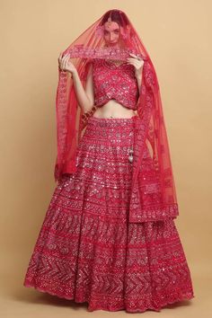 Festive red lehenga with an attached cancan and mirror and thread embroidery. Comes with a padded blouse and a dupatta. - Aza Fashions