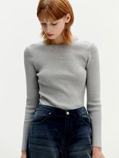 This is MONGDOL’s classic round neck knit that exudes a simple mood. Made with RNP special yarn, it offers a soft texture that allows for comfortable wear without irritating the skin. The ribbed fabric provides elasticity, ensuring a comfortable fit while accentuating the body's natural lines. This versatile item can be worn alone or layered, making it perfect for various occasions. It's ideal for creating a feminine yet casual look. The fit gently hugs the body, adding a touch of refinement to any outfit. Pair it with items like cardigans or blazers for a more polished formal look during the transitional seasons.- Ideal for daily wear- Can be paired with various styles of bottoms to create different looks- Its basic design makes it easy to match with any outfit Gray Ribbed Crew Neck Knit Top, Natural Line, Basic Design, Formal Looks, Soft Texture, Ribbed Fabric, Soft Textures, Casual Looks, Daily Wear