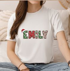 Celebrate the holiday season in style with our Custom Family Christmas Name Shirt! This unique winter-themed t-shirt features personalized monogramming that beautifully displays your family initials, making it the perfect attire for family gatherings and holiday photoshoots. Made from high-quality, soft cotton, it's designed to keep your family comfortable while showcasing your festive spirit. Available in a range of sizes, our custom shirts are made to fit both adults and children, ensuring eve Customizable White Tops For Holiday, Customizable Crew Neck Christmas T-shirt, Customizable Cotton Christmas T-shirt, Customizable Short Sleeve Christmas Tops, Customizable White Christmas Tops, Personalized White Crew Neck Shirt, Casual Customizable Christmas Tops, White Personalized Crew Neck Shirt, Casual Christmas Tops With Customizable Details