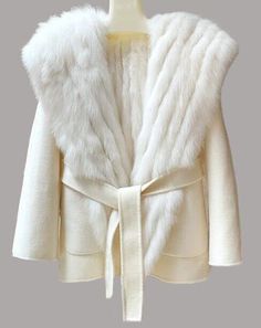 MODA  FURS   FABULOUS FUR FASHIONS AT UNBEATABLE PRICES   Women's Warm and Cozy 100% Wool Jacket with Fixed Hood  Warm and Cozy White Fox Fur Lining Side Pockets, Front Closures and Detachable Belt Length: 29" S/M     CONDITION CHART: FUR RESTYLING SERVICES:       SERVICES: Brand New    Never used or Worn Showroom New  Showroom Item / Not Pre-Owned Refurbished New 2 Excellent fur coats dramatically remodeled to an updated fresh design as if it was just bought yesterday! Excellent/Perfect/Superb Winter White Double-lined Hood Outerwear For Fall, Winter White Outerwear With Double-lined Hood For Fall, Winter White Outerwear With Detachable Hood For Fall, Luxury Cream Fur Coat For Winter, Chic Hooded Fur Coat For Winter, Luxury Winter Fur Coat For Cold Weather, Fitted Hooded Fur Coat For Winter, Cream Shawl Collar Winter Outerwear, Cream Shawl Collar Outerwear For Winter