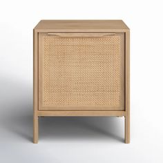 the side table is made out of wood and has a rattan pattern on it