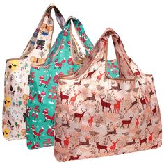 three bags with animals on them sitting side by side in front of a white background