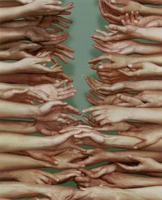 many hands reaching out to each other