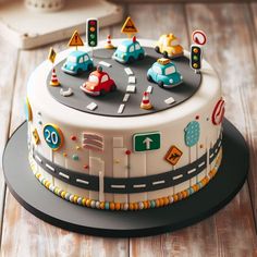 a cake decorated with traffic signs and cars