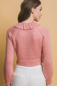 Introduce a touch of elegance to your wardrobe with our Short Collared Sweater. This chic sweater features a stylish short collar and is crafted from a luxurious fabric blend. The vibrant Pink color adds a lively and modern twist to this sophisticated design. Key Features: Fabric: Made from 90% acrylic, 7% polyester, and 3% metallic, offering a soft, durable, and subtly shimmering finish. Fit: Designed for a flattering fit with a short collar that enhances its elegant appeal. Color Options: Avai Elegant Pink Sweater With Button Closure, Luxury Pink Elegant Sweater, Feminine Pink Collared Top, Pink Collar Sweater, Luxury Fitted Pink Sweater, Cute Pink Peter Pan Collar Top, Collared Sweater, Chic Sweater, High Fashion Looks