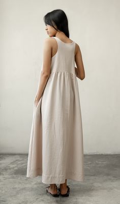 This beautiful dress, made of a linen textured cotton, is great to throw on over a bathing suit, to go shopping or out to dinner. With its wide flowing skirt feel free to do ballet, and it has pockets. It was made with care in our fair trade, in-house workshop in Bali. Hand or machine wash cold, tumble dry on low heat or line dry. Andrea & Lucy design each of our relaxed, versatile pieces to be part of a classic, timeless, minimalist wardrobe.100% Cotton - Hand or machine wash warm, tumble dry low Pictured: Size S on Saras: Size 2 US (XS) • Height 5’5” (164cm) SizesSmall: women's 4-6.Medium: women's 8-10.Large: women's 12-14. Flowy Linen Dresses, Unlined, Flowy Linen Dresses Unlined, Flowy Linen Dress For Loungewear, Linen Maxi Dresses For Loungewear, Relaxed Fit Linen Maxi Dress For Loungewear, Neutral Summer Dress With Pockets, Beach Midi Dress With Pockets In Beige, Beige Midi Dress With Pockets For Beach, Beige Beach Midi Dress With Pockets